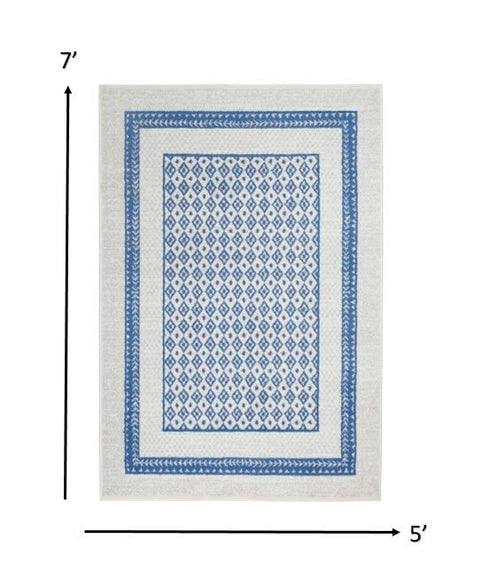 Ivory and Blue Geometric Area Rug